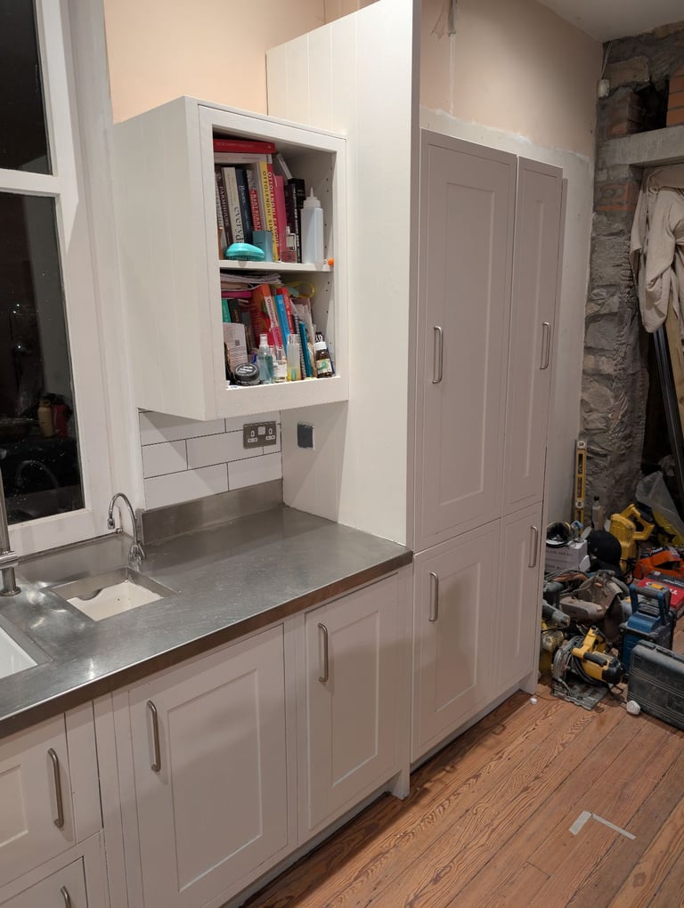 Hand painted solid wood shaker kitchen with steel worktop and Belfast sinks. 