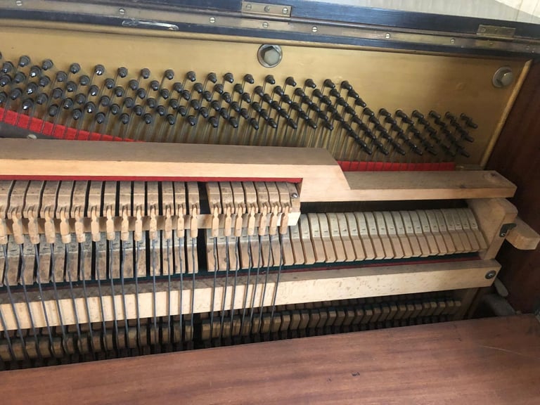 Upright Piano by Stanley Brinsmead London, 7 Octaves, 88 keys, dark wood.  Good condition.