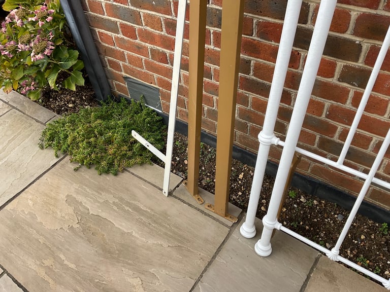White wrought iron bedstead