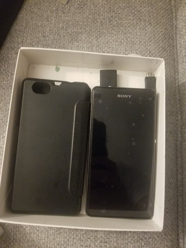 Black sony mobile with charger