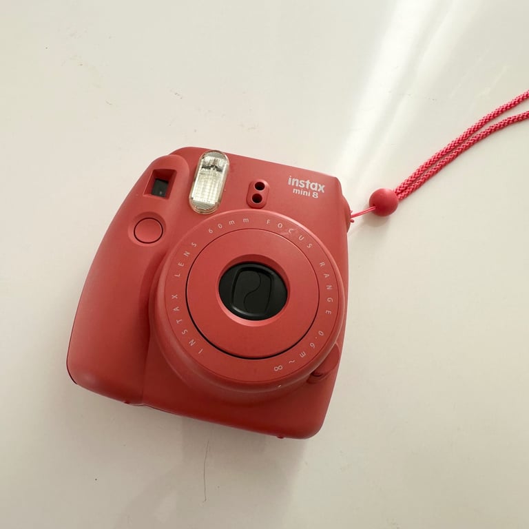 Fujifilm Instax mini 8 OR mini 9. 60mm lens. Point and shoot camera.