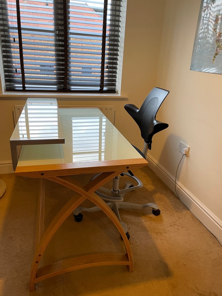 Wooden desk with reinforced glass top