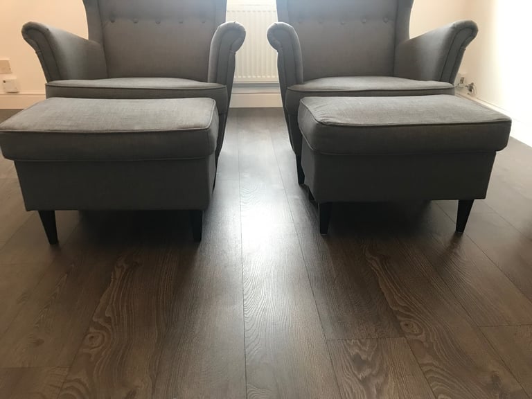 2 grey fabric high backed wing tipped chair with matching 2 grey fabric footstools, £140 for all 