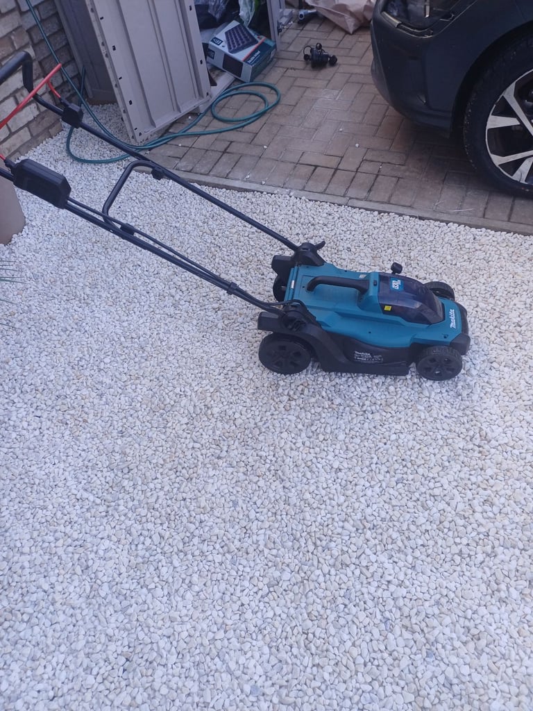 image for Makita cordless lawn mower + 5 amp makita battery 