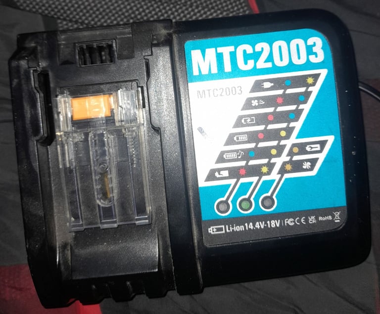 Makita radio with 2 18v batteries and charging statuon. 