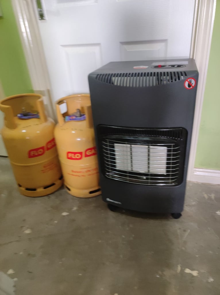 Portable gas heater with wheels plus 2 flogas butane gas cylinder's 