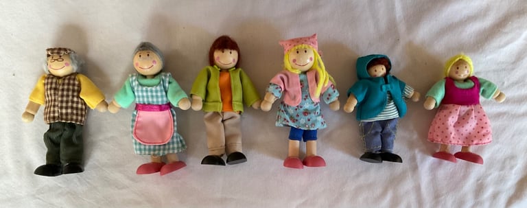 Handmade wooden dolls house with furniture and family