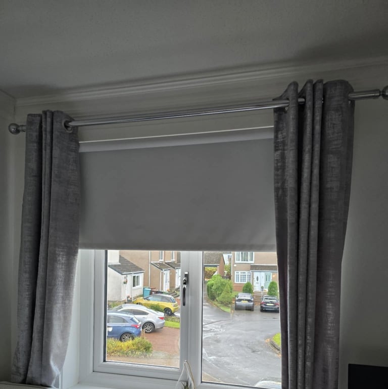 Chrome curtain pole with curtains