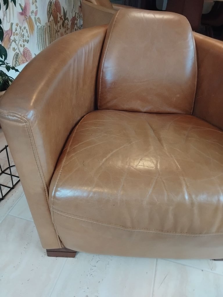 Pair of Halo Rocket/Aviator chairs in Old Saddle Nut leather. Two chairs.