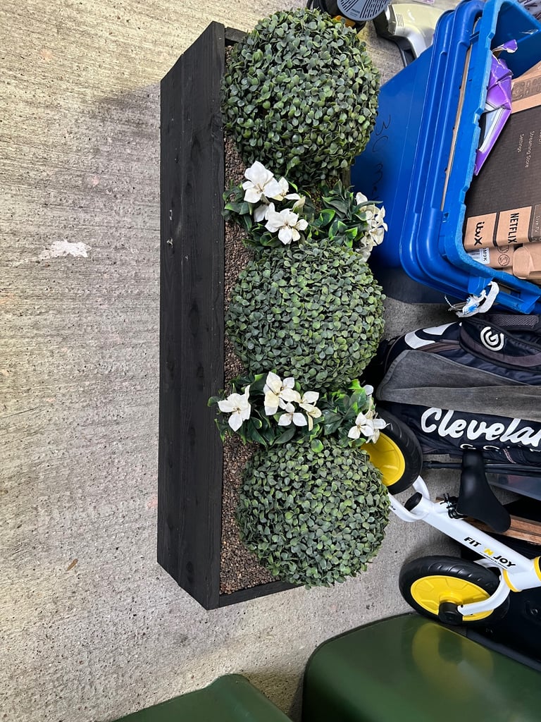 Fake plant in planter 
