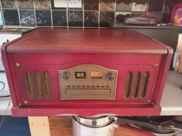 Vintage wooden Audio System. Plays Radio, Record and Cassette. Cd doesnt seem to play. 