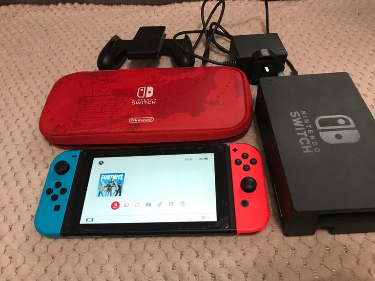 Nintendo Switch console with 3 games