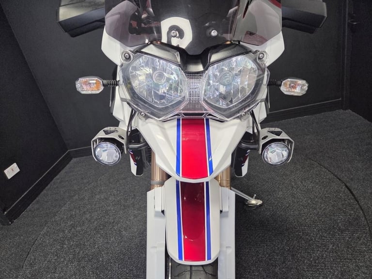 2013 Triumph Tiger Explorer 1215 in white with luggage.