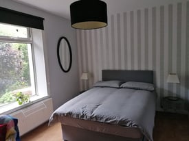 Large sunny room in a two bedroom property 