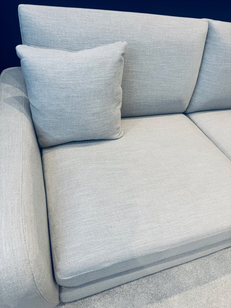 Beige three seater sofa as new
