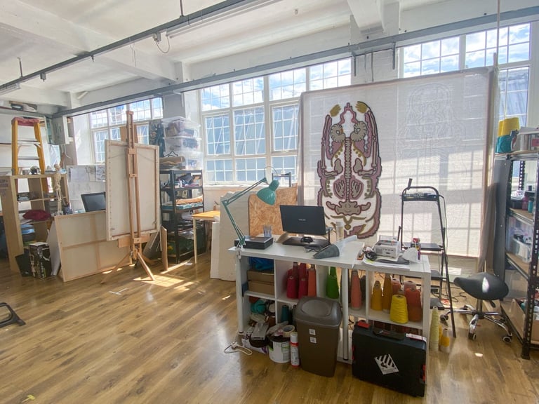 Deskspace in shared artist co-working space