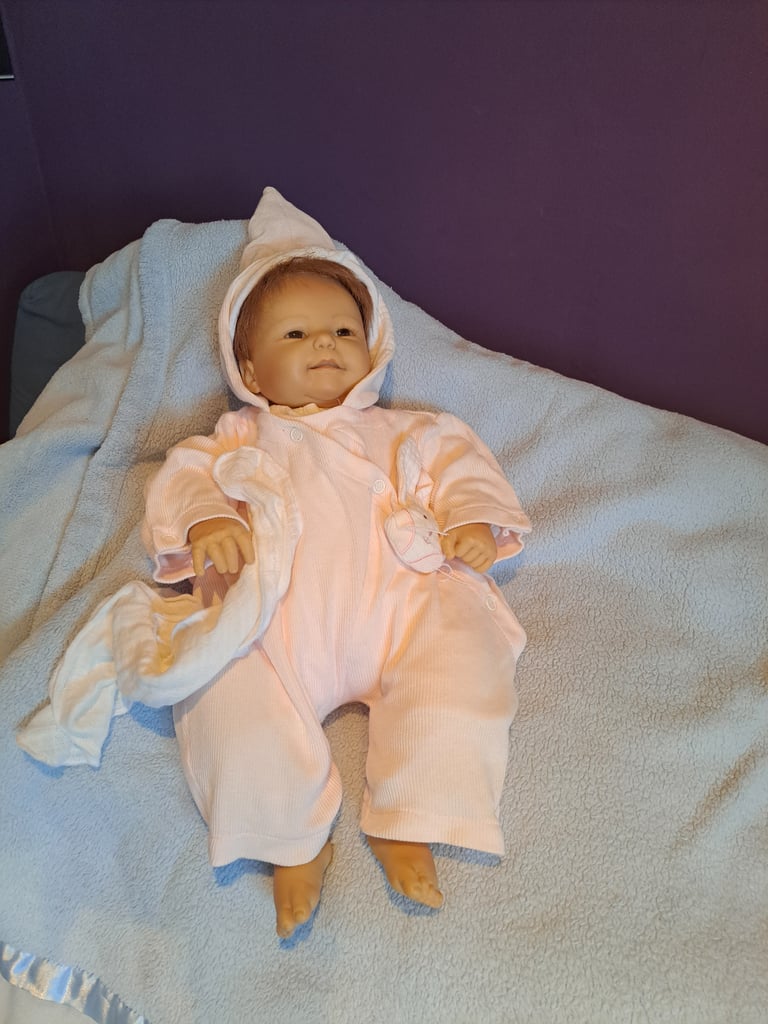 Collectable baby dolls and antique style pram