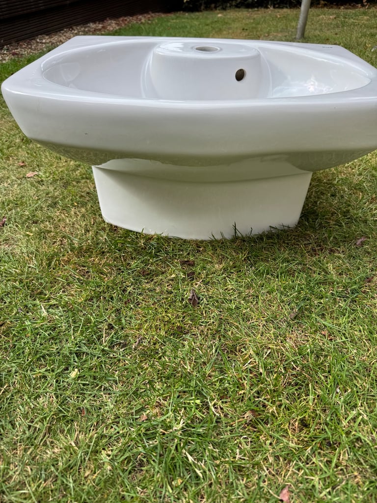 Roca brand white ceramic wall hanging cloakroom sink.  