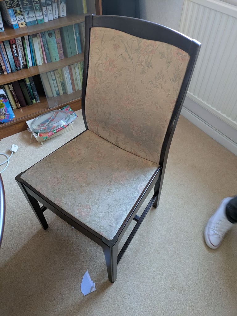 Stag Minstrel dining table and four chairs