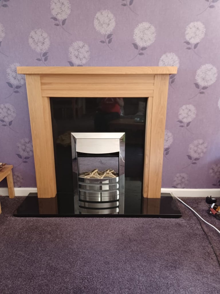 Oak fire surround with electric fire