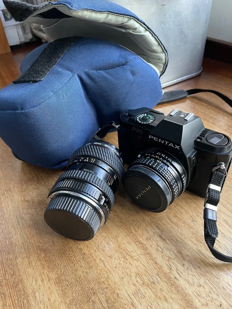 Pentax P30 SLR with 50mm lens; with case plus Tokina 28-70mm lens