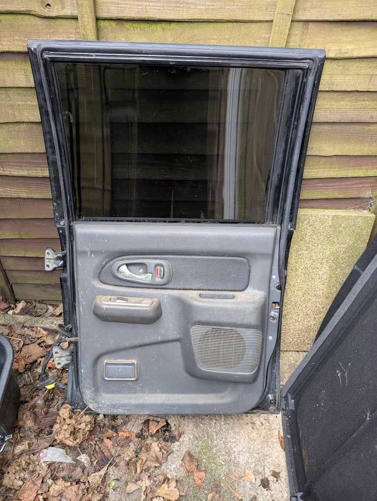 Mitsubishi L200 K74 06 black drivers side back door 