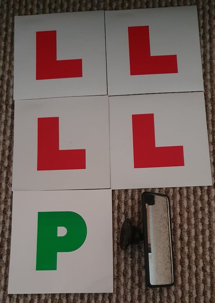 4 L plates and 1 P plate, rear mirror including routes to practice around the centre.