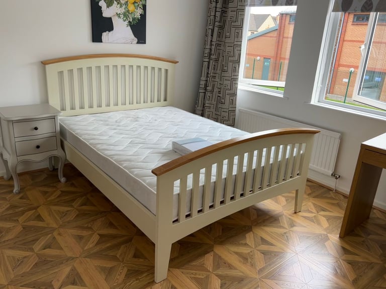 A bright bedroom in a three-bedroom apartment is available for rent.