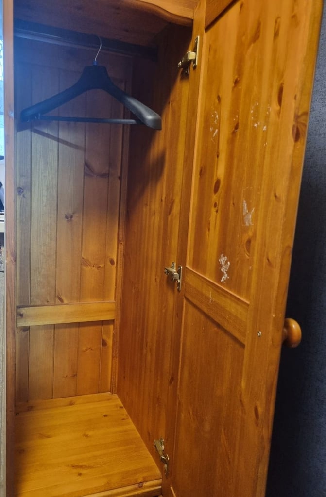 Tall slim cupboard with drawers hanging rail and separate storage 