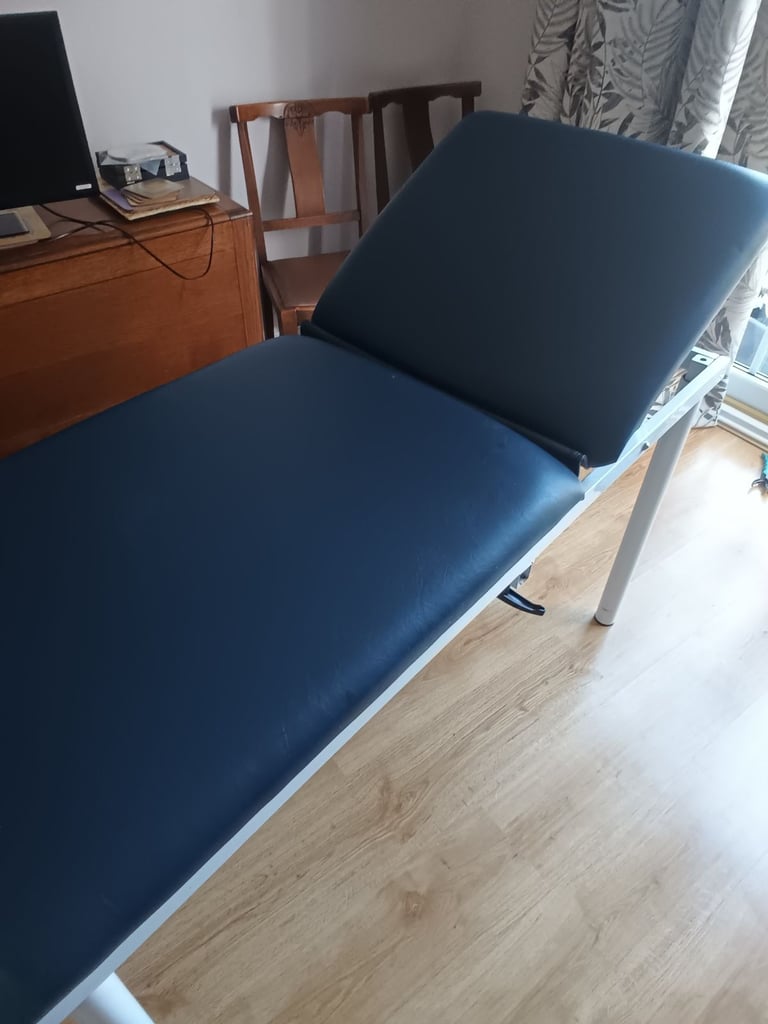 Meditelle small adult/ paediatric static couch with padded sides.
