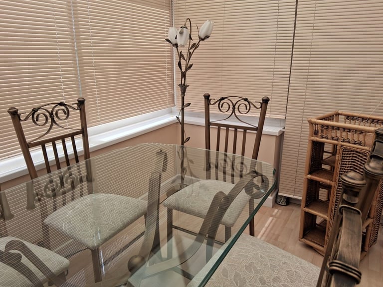 Glass-topped dinging table & 6 chairs