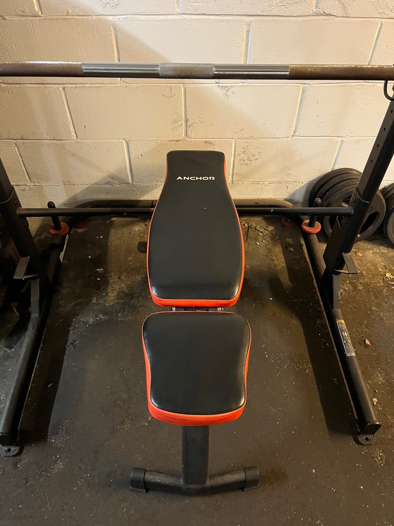 Rack + bench + bar + weights + dumbbell 