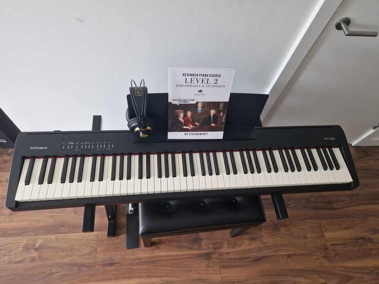 Roland FP-30 piano keyboard with a stand, Roland bench, pedal, professional headphones, cover, books
