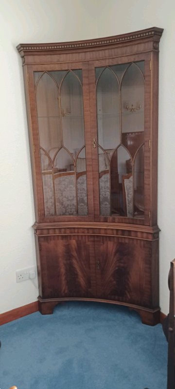 Concave mahogany display cabinet.