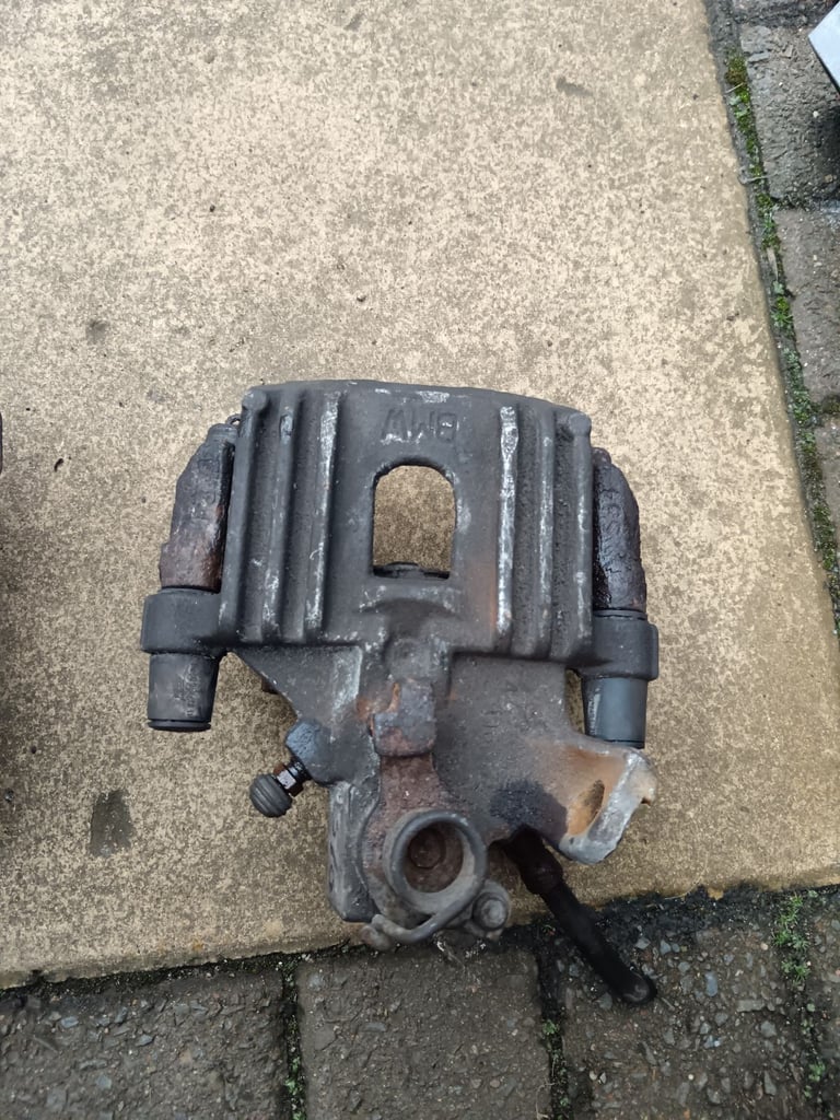 Mini R50/R52 rear drivers side brake caliper and hanger, good working condition 