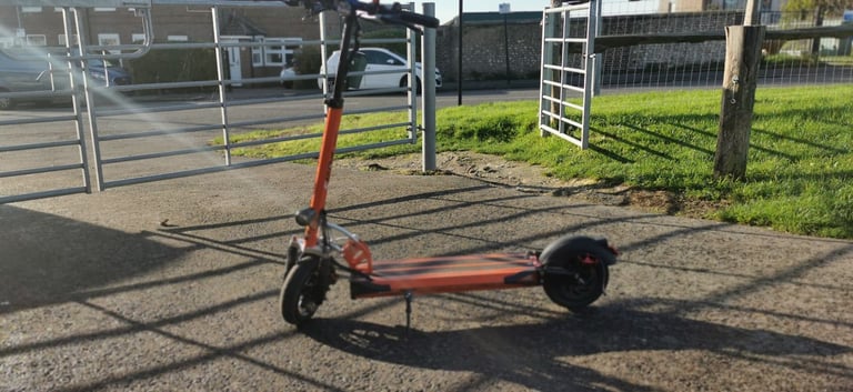 From USA an Orange electric scooter EMOVE Cruiser 'S' 52V 1600W Dual