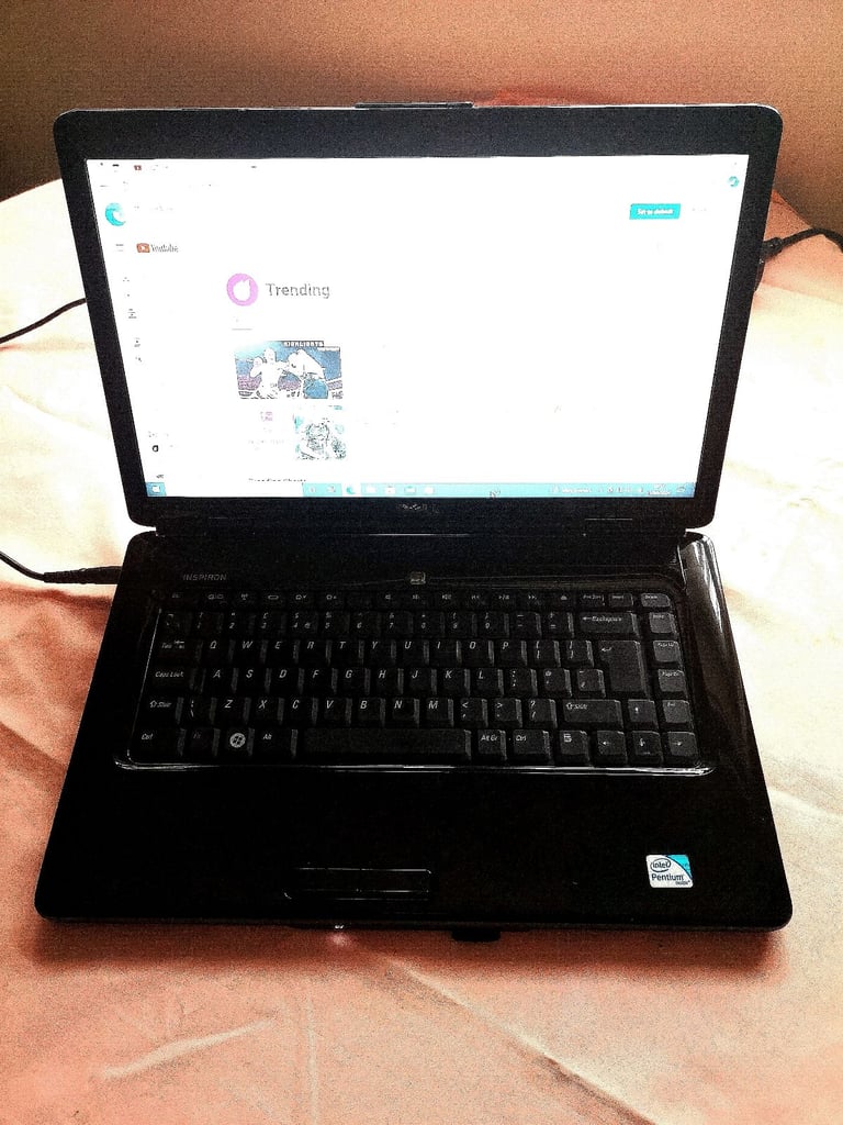 Dell Inspiron Laptop on Windows 10 with pink colour lid. . Pink colour. 