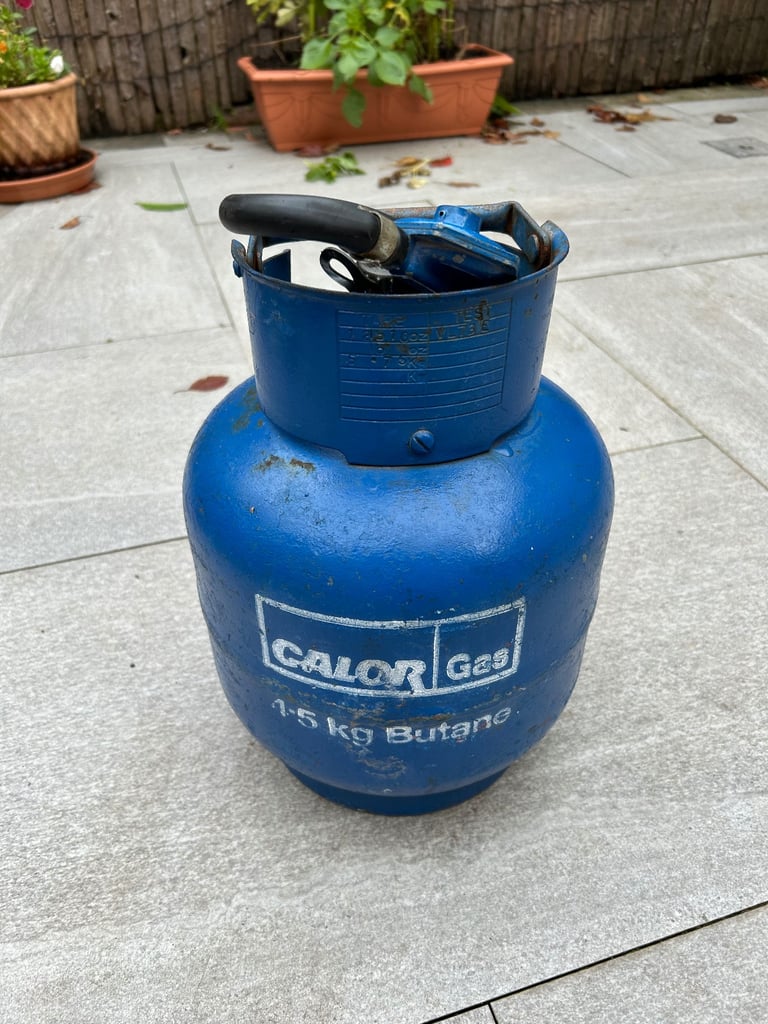 Empty 4.5 KG Calor gas bottle with regulator.