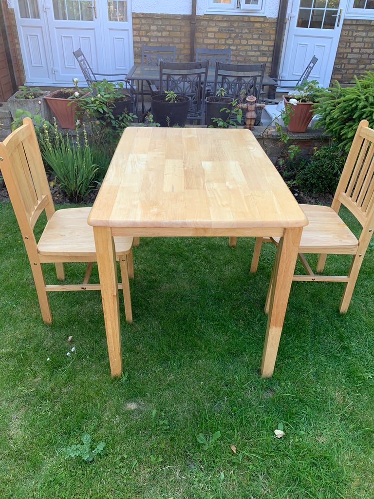 Wooden table with two chairs 