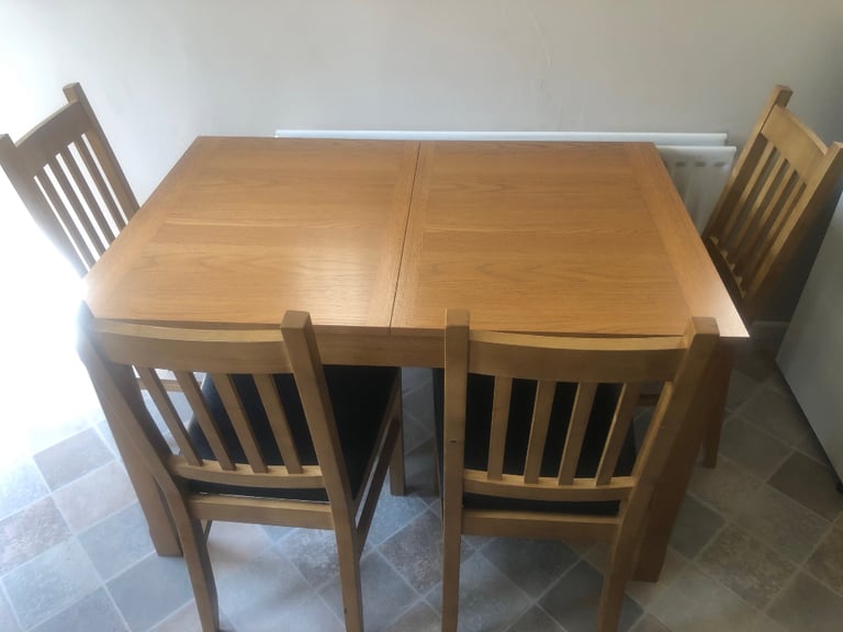 Solid Oak dining room table & 4 chairs