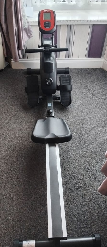 Rowing machine and weights bench