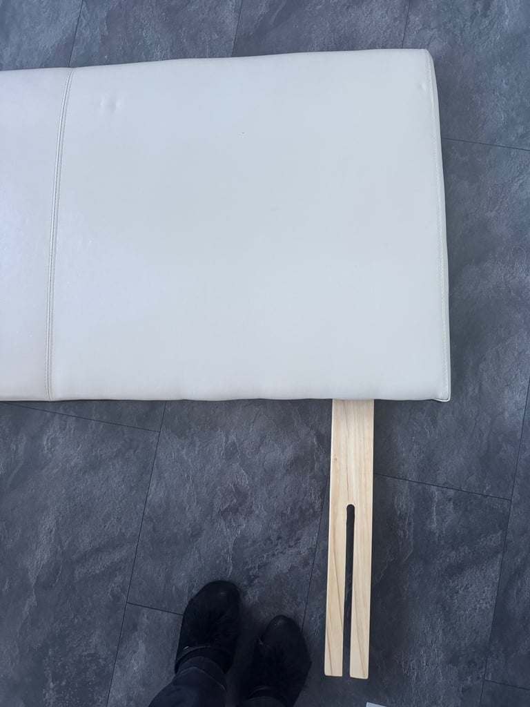 Double cream faux leather headboard. 