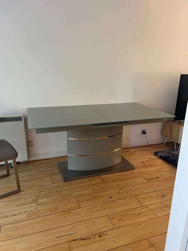 Modern glass table with glass face.