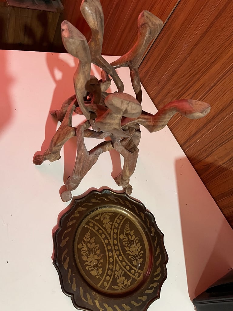 Hand carved wooden table/brass plate