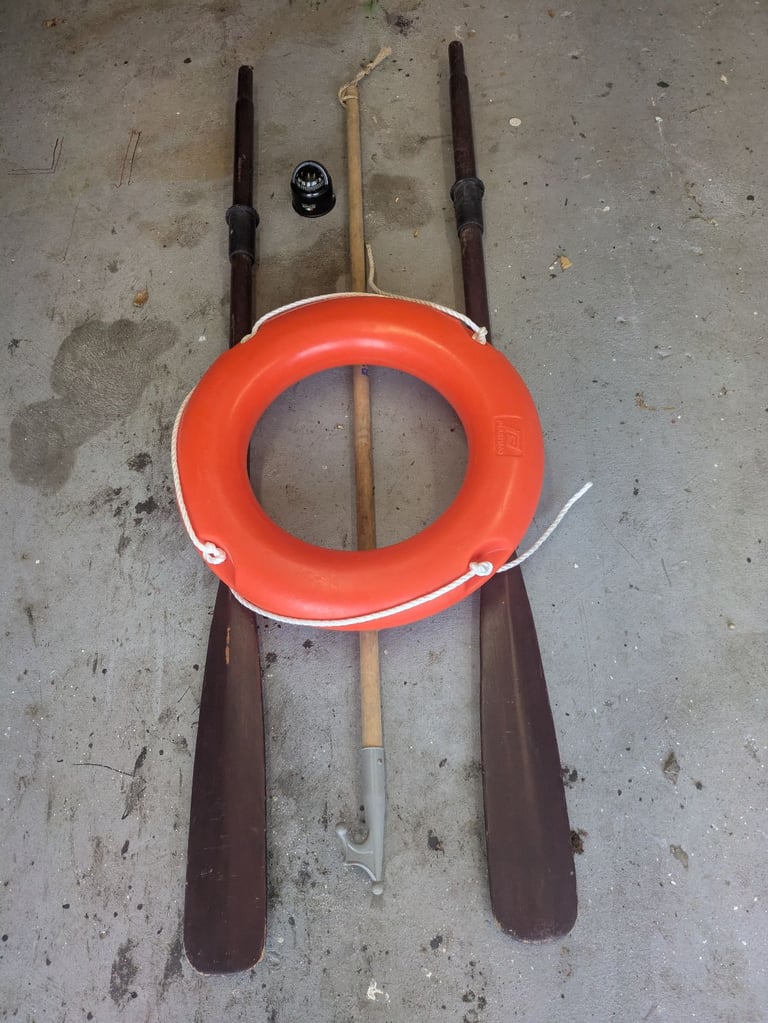 Oars, boat hook, safety ring and compass