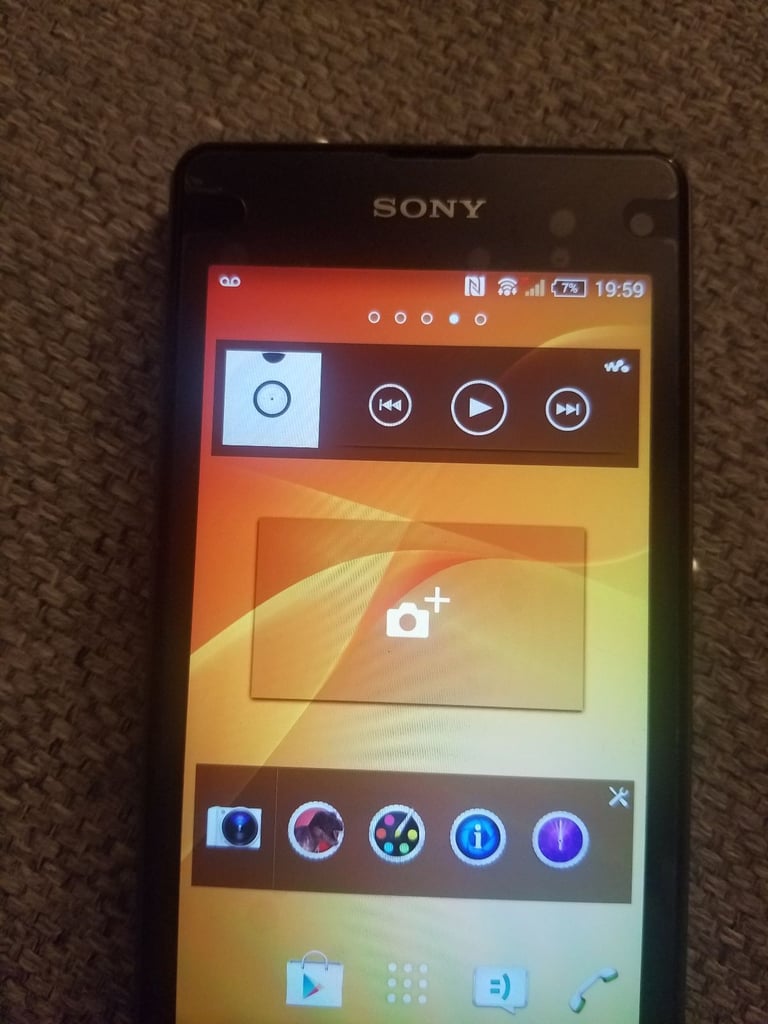 Black sony mobile with charger