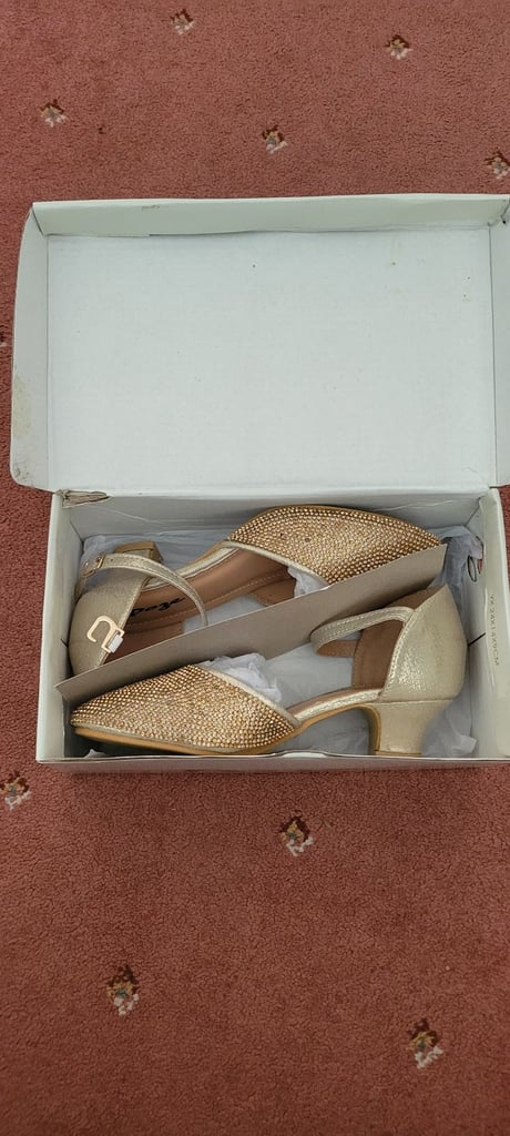 Girls gold heel sandals.