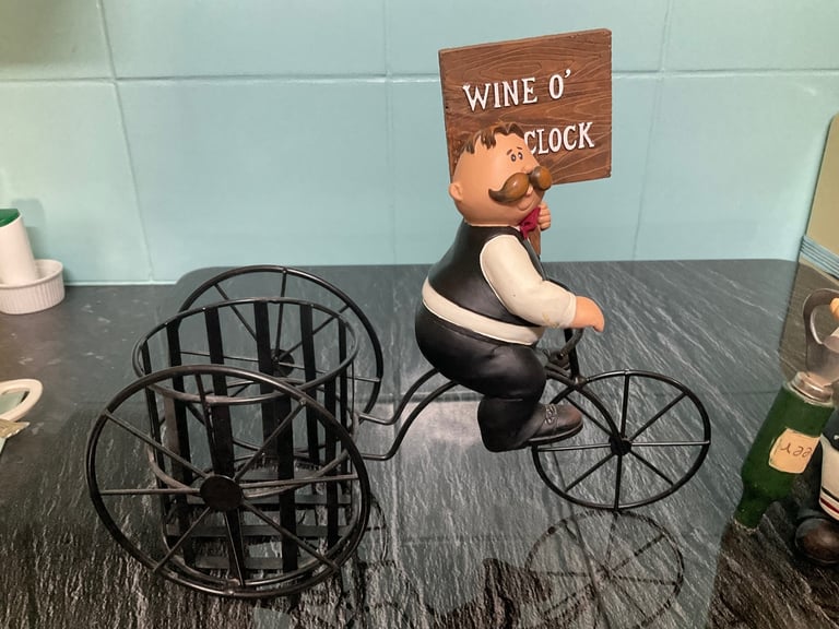 Bottle holder and opener.
