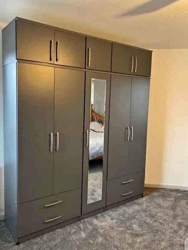 Modern Bedroom Furniture. Bedroom Suit Includes Bedside Tables, Chest of Drawers and Wardrobes