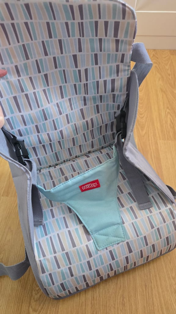 image for Nuby Travel Booster Seat, Folds Into A Handy Bag